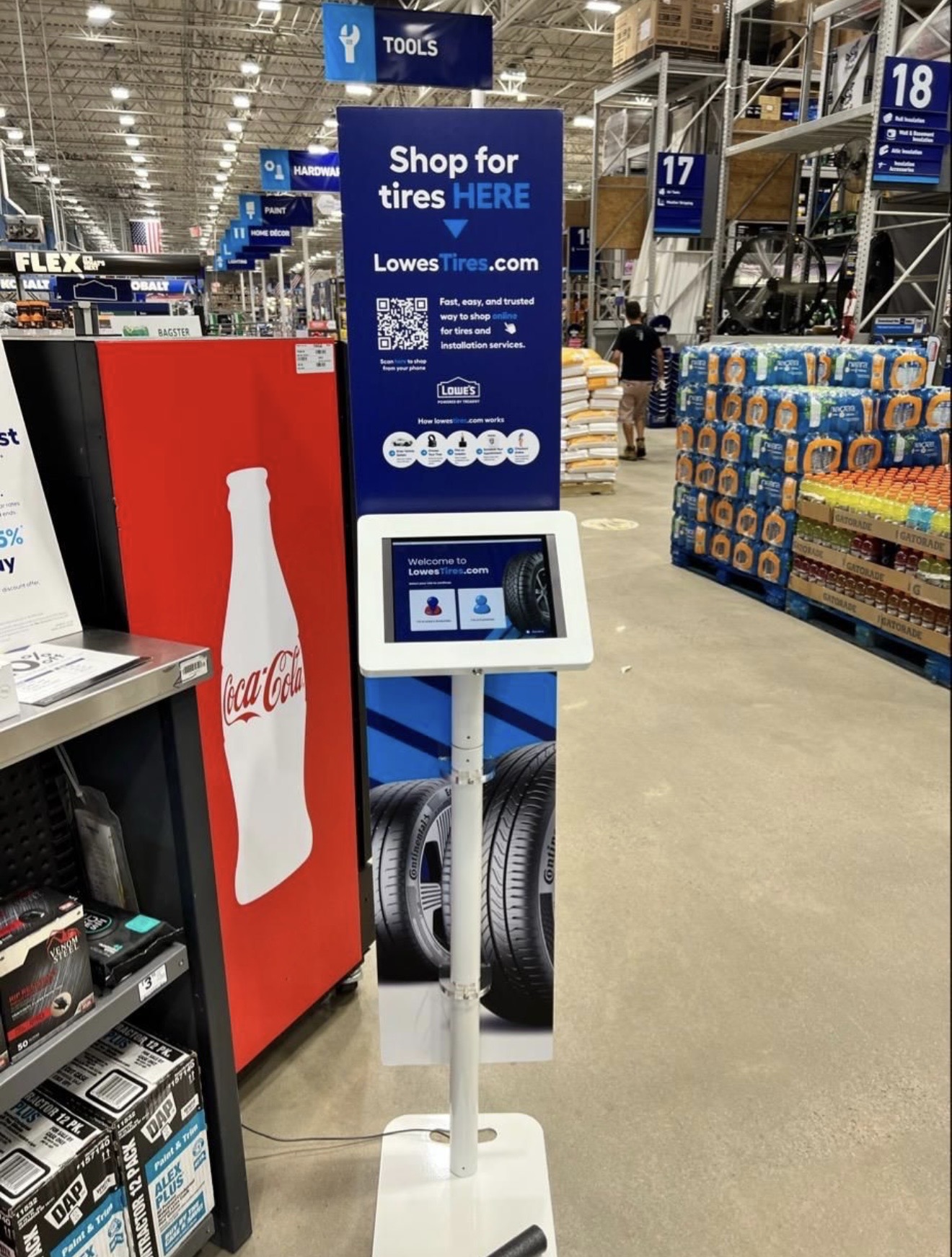 A Lowe's Tires self-service kiosk installed inside a Lowe's store.