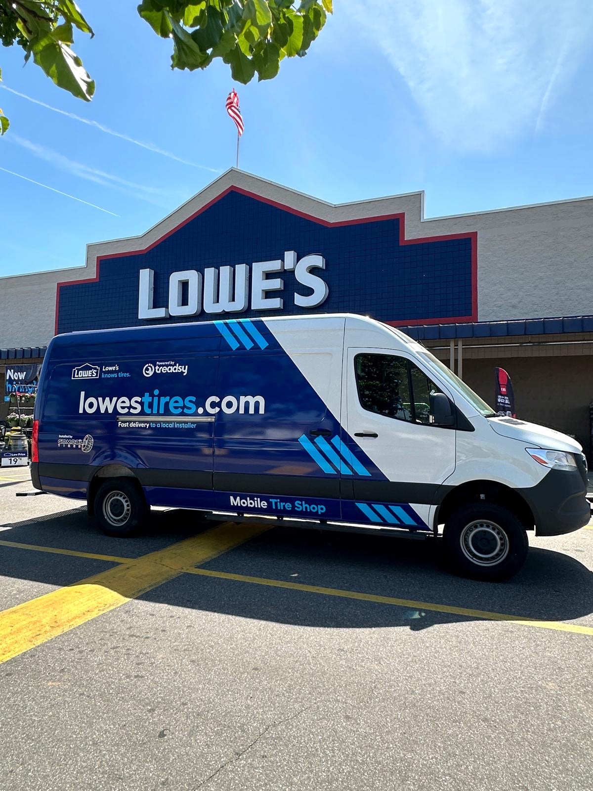 A Lowe's Tires mobile tyre van powered by Treadsy parked outside a Lowe's store.